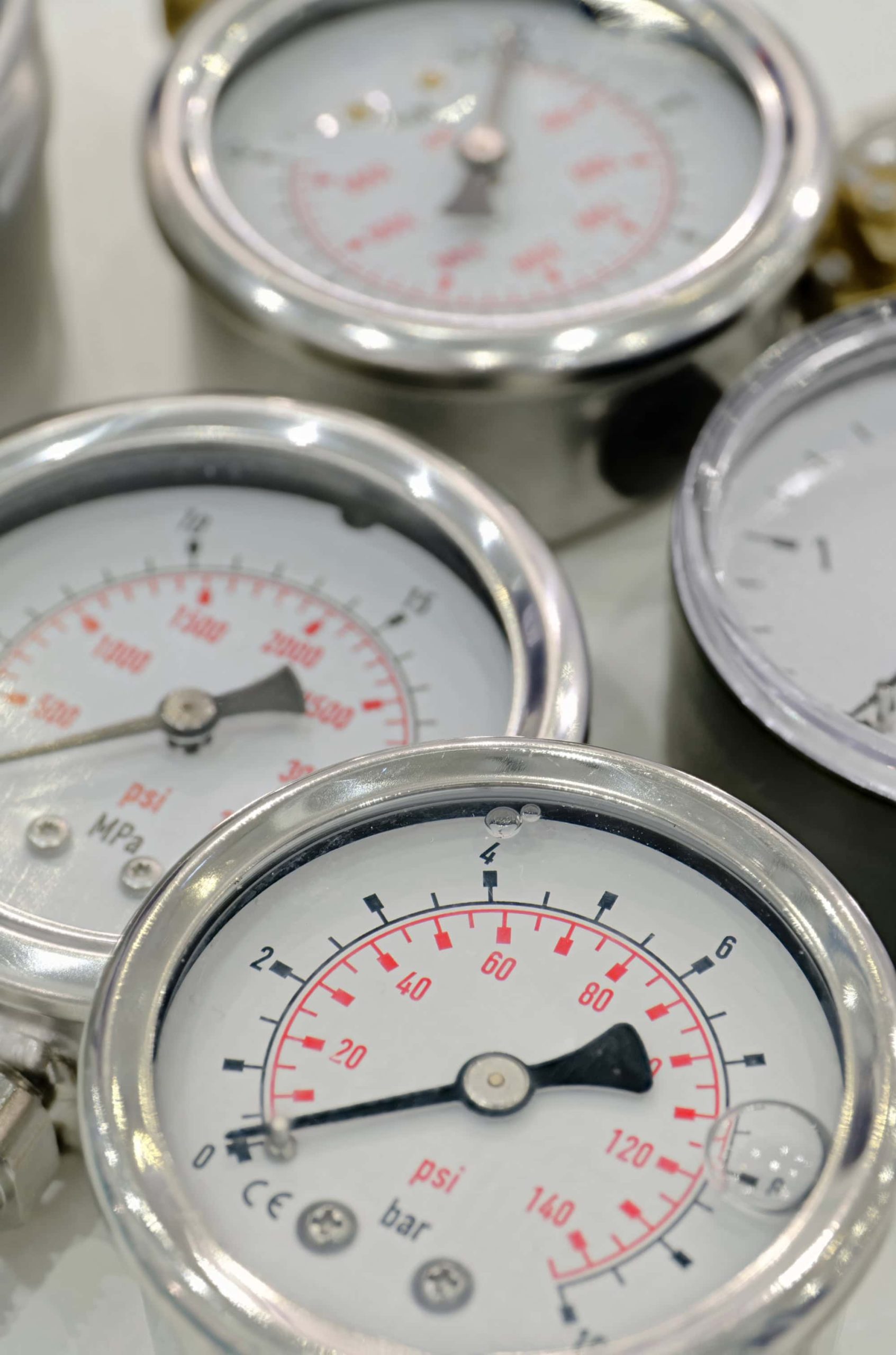 Close-up of precision pressure gauges used in Ascleus medical-grade aesthetic and wellness devices"