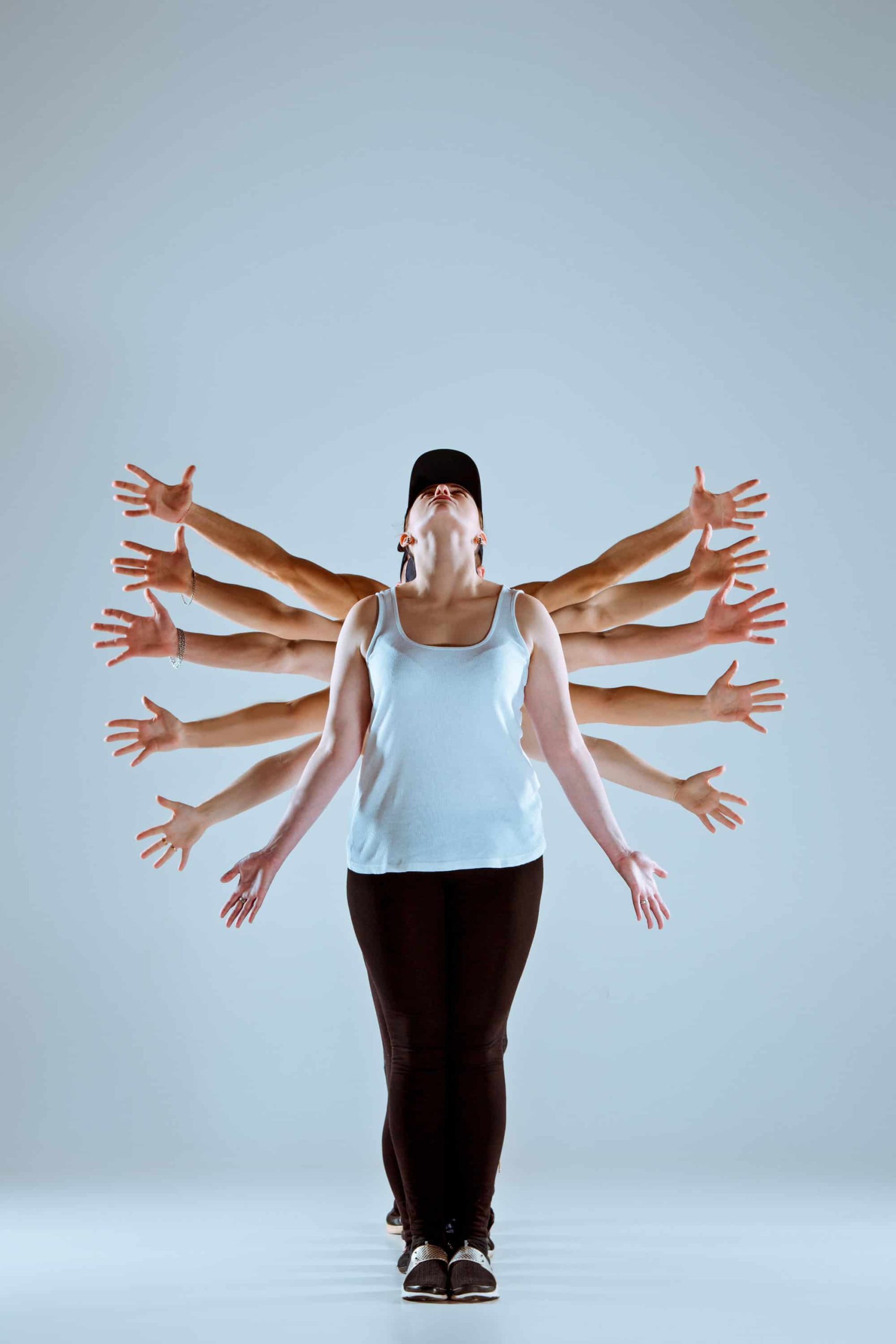 Woman in motion pose with extended arms representing energy flow and full-body activation, mirroring Ascleus’s cellular stimulation approach.